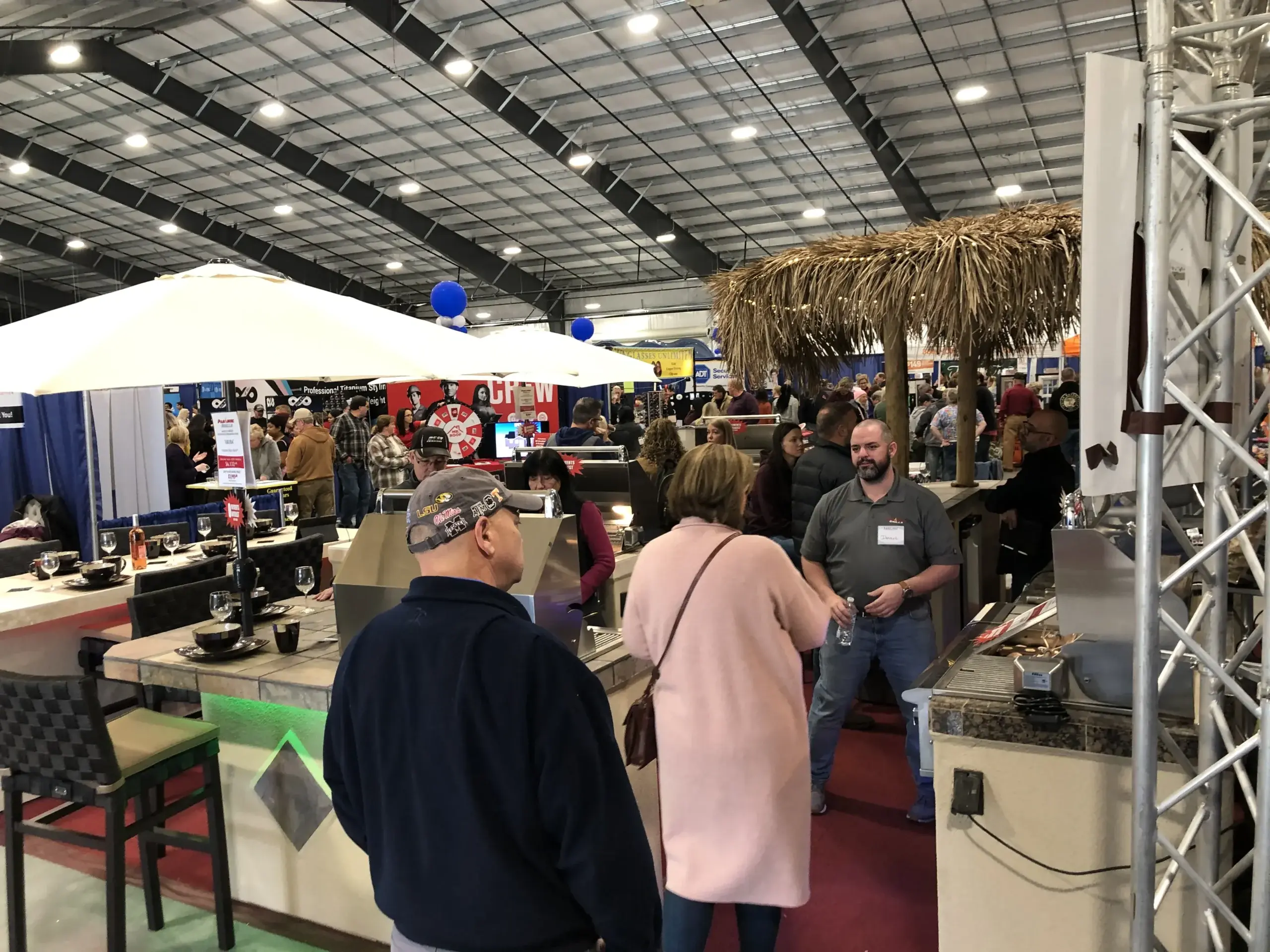 Visitors exploring exhibitor booths at a Home Show.